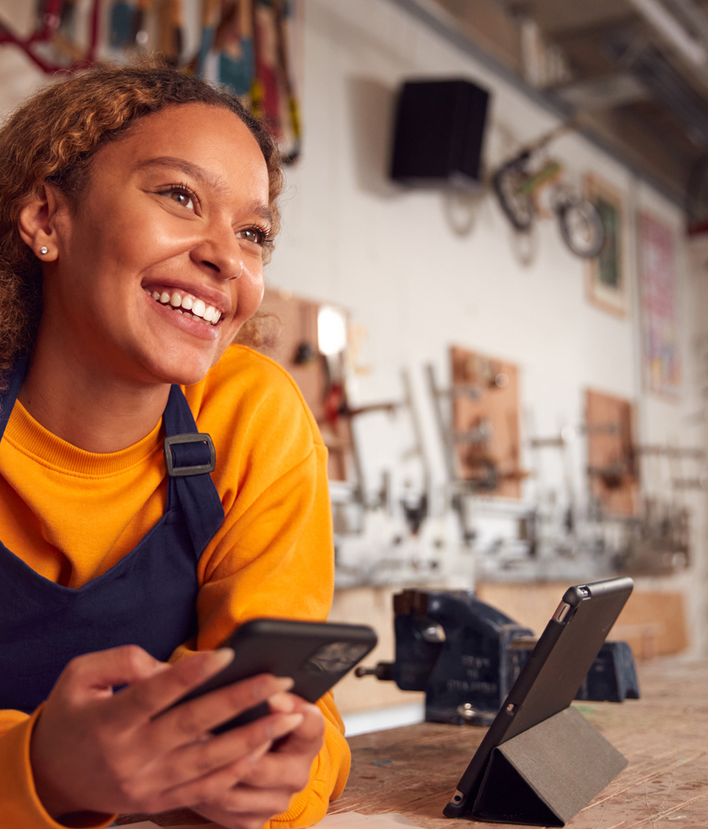 smiling restaurant owner behind counter